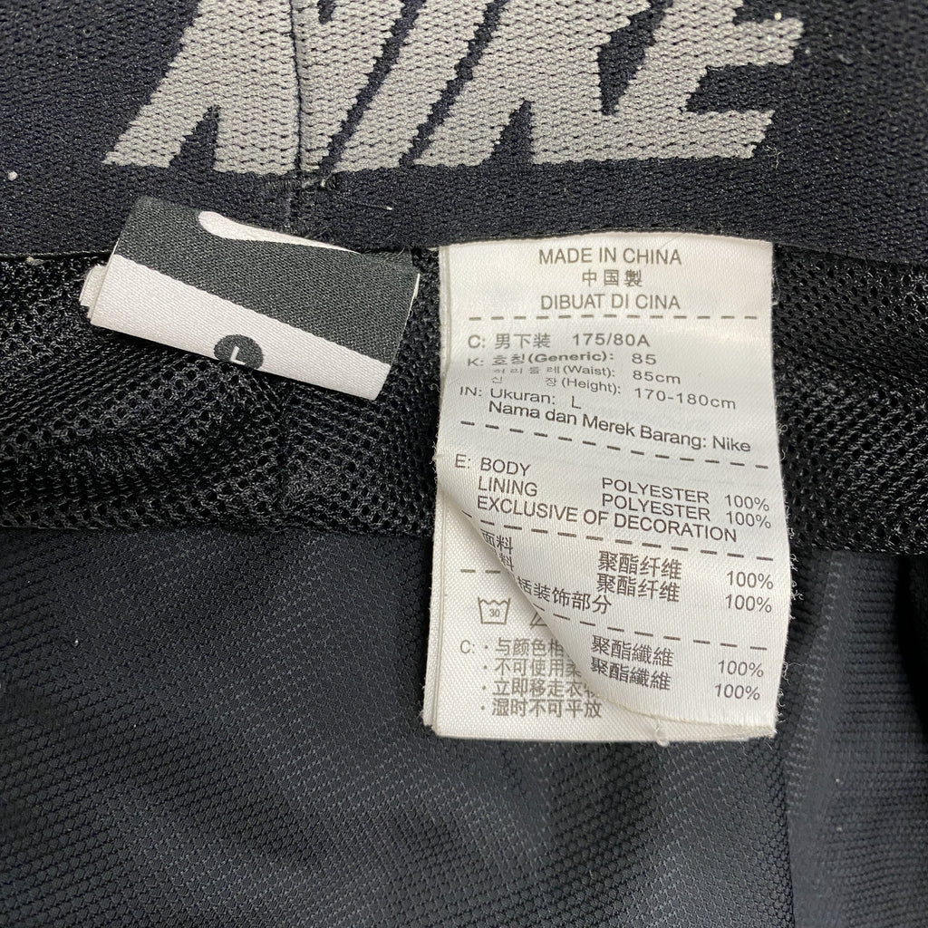 NIKE　ナイキ　ピステパンツ/ウィンドパンツ　トラックパンツ　スウッシュ　黒　ブラック　Lサイズ　古着