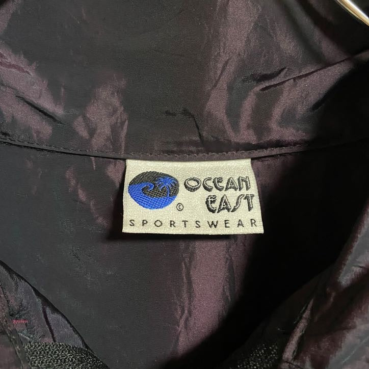 古着 used　OCEANEAST　長袖ハーフジップナイロンジャケット　ハイネックプルオーバー　光沢感　ワンポイント刺繍　秋冬服