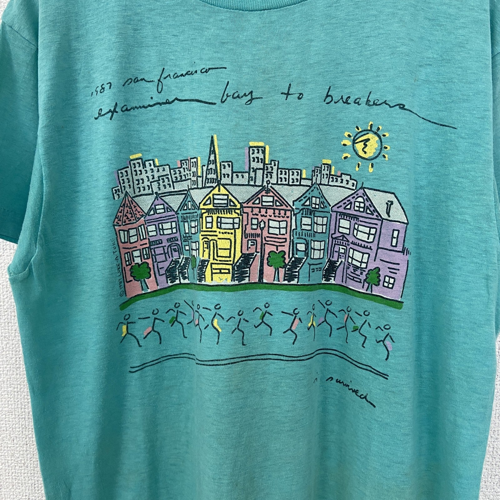 半袖プリントTシャツ　街並み　カラフル　カジュアルデザイン　青　ブルー　シングルステッチ　90s　Lサイズ　　ヴィンテージ　古着