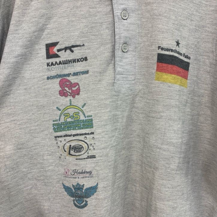 　FRUIT OF THE LOOM　半袖プリントポロシャツ　バックプリント　レトロ　国旗　灰　グレー　灰色　Lサイズ　古着