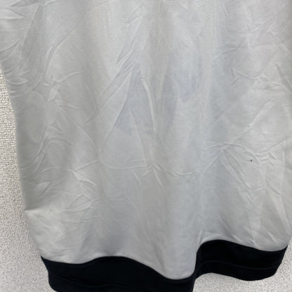 古着 used　90s　NIKE ナイキ　半袖フルジップジャージ　スウッシュロゴ　プリントデザイン　バイカラー　黒　白　Mサイズ