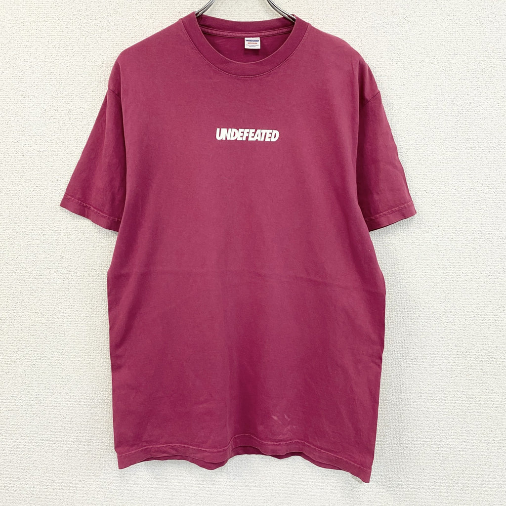 UNDEFEATED　アンディフィーテッド　半袖プリントTシャツ　ピンク　Mサイズ　　古着