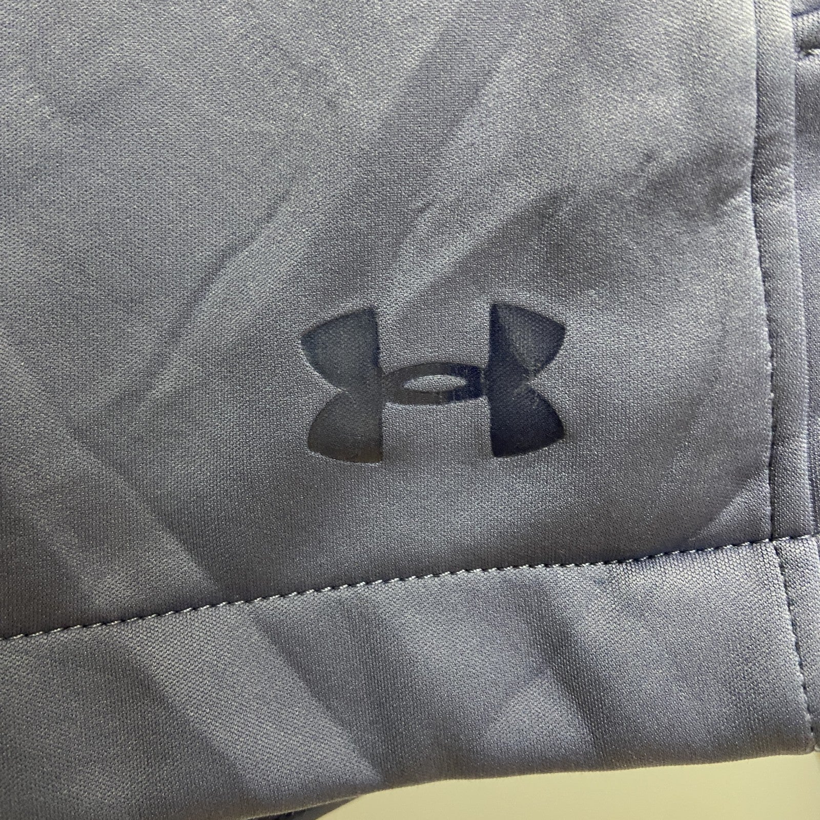 UNDER ARMOUR　アンダーアーマー　トラックジャケット/ジャージ　裏地フリース　フェード　ワンポイント　青　ブルー　Mサイズ　古着