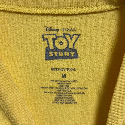 古着 used　Disney　TOYSTORY　トイストーリー　長袖公式キャラクタープリントスウェット　トレーナー　黄色　Mサイズ